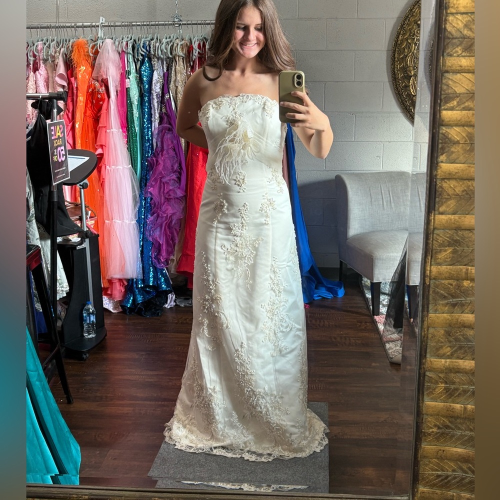 Elegant Strapless Cream Gown with Unique Details
